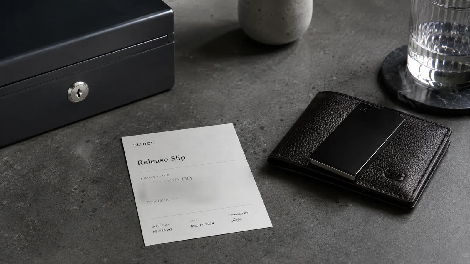 A lockbox, a release slip and a leather wallet — funds leaving custody